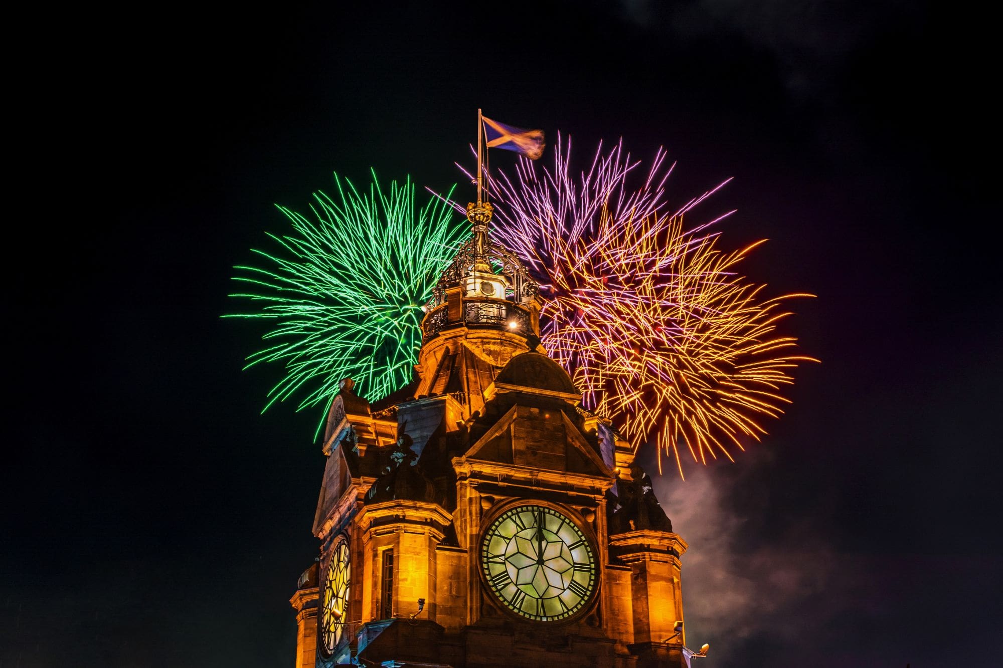Balmoral Clocktower with colourful fireworks behind
