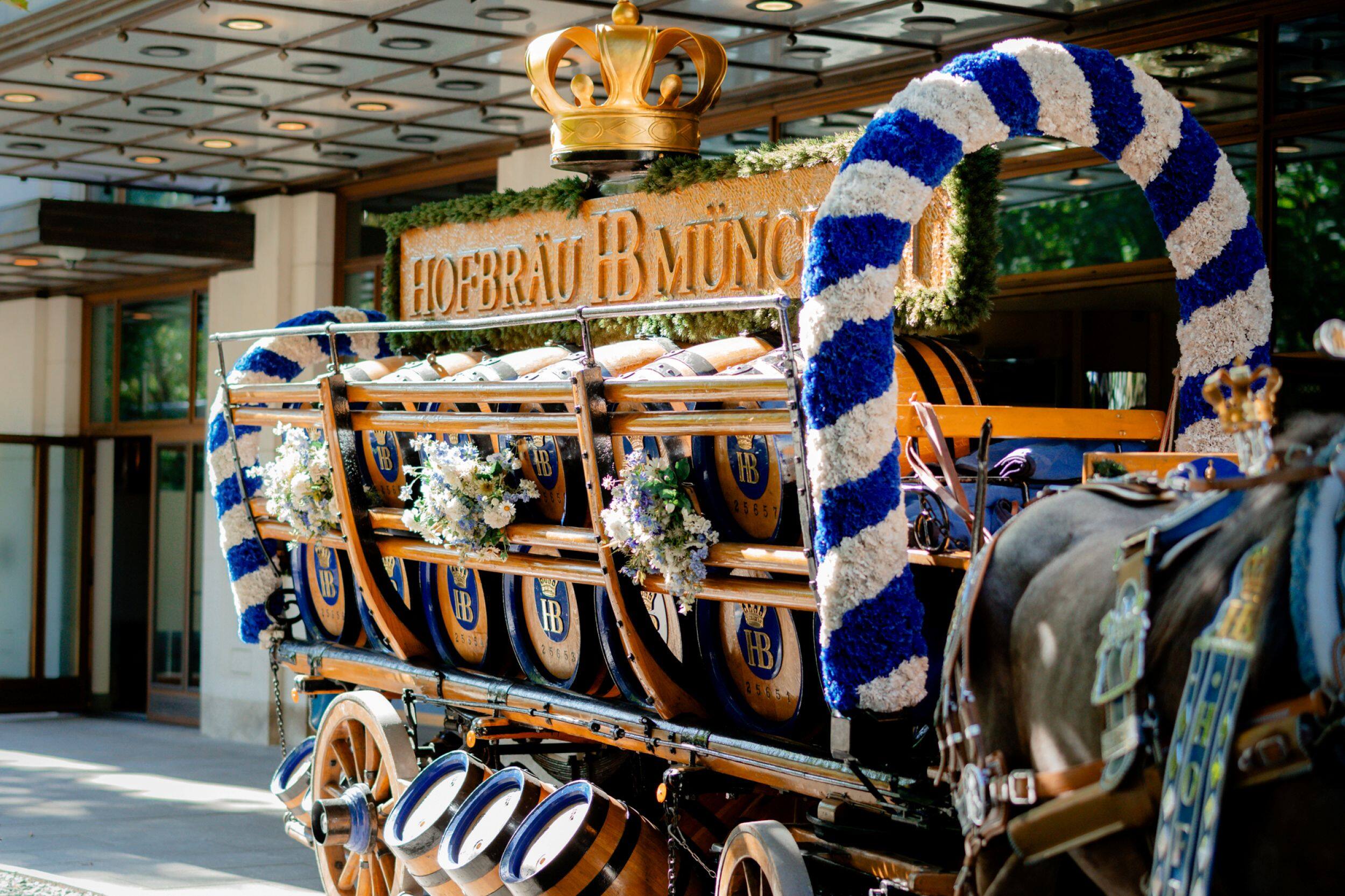 A view of a carriage loaded with beer barrels from Hofbräu on its way to Oktoberfest, parked outside The Charles Hotel in Munich near the Oktoberfest